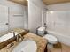 Bright bathroom featuring a tub-shower combo, toilet, and a granite vanity with double sinks at 120 Madison Grace Ave, Mcdonough, GA 30252