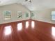 Bonus room with hardwood floors, natural light and a high vaulted ceiling at 120 Madison Grace Ave, Mcdonough, GA 30252