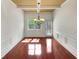 Dining room featuring gleaming wood floors, a stylish chandelier, and wainscoting at 120 Madison Grace Ave, Mcdonough, GA 30252