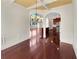 Dining room with hardwood floors leading to the kitchen with stainless steel appliances at 120 Madison Grace Ave, Mcdonough, GA 30252