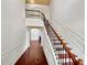 Elegant staircase with wood and iron railings, leading to the upper level at 120 Madison Grace Ave, Mcdonough, GA 30252