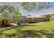 Expansive backyard with lawn, patio, storage shed, and privacy fence at 2344 Belmont Dr, Decatur, GA 30032