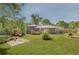 Large backyard featuring a nice lawn, patio, storage shed, and privacy fence at 2344 Belmont Dr, Decatur, GA 30032
