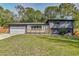 Charming two-story home with a well-manicured lawn and a modern gray brick facade at 2344 Belmont Dr, Decatur, GA 30032