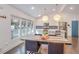 Bright kitchen with white cabinets, stainless steel appliances, and a breakfast bar island at 2344 Belmont Dr, Decatur, GA 30032
