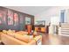 A living room with hardwood floors, an entertainment center, and an adjacent staircase leading to the second floor at 2344 Belmont Dr, Decatur, GA 30032