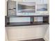 Compact home office nook featuring a minimalist floating desk and stylish organization system at 2344 Belmont Dr, Decatur, GA 30032