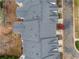 Aerial view highlighting the roof and streetscape surrounding the residence at 4908 Waters Edge Trl, Roswell, GA 30075