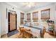 Bright dining area featuring natural lighting, classic wooden furniture, and neutral decor at 4908 Waters Edge Trl, Roswell, GA 30075