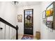 Welcoming foyer featuring tiled flooring, a charming front door, and stylish decor at 4908 Waters Edge Trl, Roswell, GA 30075