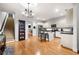 Bright kitchen boasts white cabinets, a center island with bar seating and stainless steel appliances at 4908 Waters Edge Trl, Roswell, GA 30075