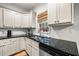 Bright kitchen with granite countertops, stainless steel appliances, and traditional style cabinetry with lots of storage space at 4908 Waters Edge Trl, Roswell, GA 30075