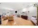 Spacious living room with hardwood floors, neutral decor, a fireplace, and ample seating at 4908 Waters Edge Trl, Roswell, GA 30075