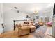 Bright living room showcasing hardwood floors, a fireplace, and a view of the neighborhood at 4908 Waters Edge Trl, Roswell, GA 30075
