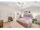 Inviting main bedroom features a neutral color scheme, vaulted ceiling, and ample natural light at 4908 Waters Edge Trl, Roswell, GA 30075