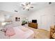 Airy main bedroom with vaulted ceiling, ceiling fan, and access to a comfortable sitting area at 4908 Waters Edge Trl, Roswell, GA 30075