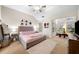 Spacious main bedroom with vaulted ceiling, sitting area, and neutral decor evokes warmth and comfort at 4908 Waters Edge Trl, Roswell, GA 30075