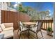 Cozy deck featuring comfortable seating and privacy fence, perfect for outdoor relaxation at 4908 Waters Edge Trl, Roswell, GA 30075
