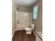 Bright bathroom with a shower-tub combination and a granite countertop vanity at 95 Kendall Ln, Covington, GA 30014