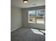 Bedroom with neutral walls, carpet flooring, and a window providing ample natural light at 95 Kendall Ln, Covington, GA 30014