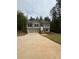 Charming two-story home with a two-car garage, stone accents, and a lush lawn at 95 Kendall Ln, Covington, GA 30014