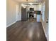 Modern kitchen with stainless steel appliances, white cabinets, and granite countertops at 95 Kendall Ln, Covington, GA 30014