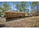 Brick home featuring a covered carport and large backyard with mature trees at 3712 Spring Hill Se Rd, Smyrna, GA 30080