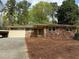 Charming brick ranch home with a carport and well-maintained front yard at 3712 Spring Hill Se Rd, Smyrna, GA 30080
