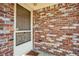 A brick home featuring a metal security door and a custom door handle at 3712 Spring Hill Se Rd, Smyrna, GA 30080