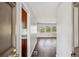 Hallway showing hardwood floors, white walls, and a view into the living room at 3712 Spring Hill Se Rd, Smyrna, GA 30080