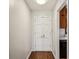 Hallway featuring hardwood floors, white walls, and closet doors at 3712 Spring Hill Se Rd, Smyrna, GA 30080