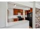 View of Kitchen from living room with breakfast bar, stainless oven, black refrigerator at 3712 Spring Hill Se Rd, Smyrna, GA 30080