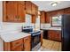 Well-lit kitchen features wooden cabinets, modern oven range, and great natural light at 3712 Spring Hill Se Rd, Smyrna, GA 30080