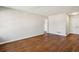 Bright living room with hardwood floors and neutral walls, and a double-door closet at 3712 Spring Hill Se Rd, Smyrna, GA 30080