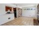 Open living area with tile floor, kitchen view and brick fireplace at 3712 Spring Hill Se Rd, Smyrna, GA 30080