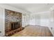 Sunlit living room with brick fireplace, closet, and outdoor access at 3712 Spring Hill Se Rd, Smyrna, GA 30080