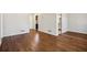 Open living room features hardwood floors, white walls, and ample natural light at 3712 Spring Hill Se Rd, Smyrna, GA 30080