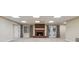 Basement area features a brick fireplace, neutral carpet and access to the backyard at 4385 Old Hamilton Mill Rd, Buford, GA 30518