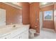 Bathroom featuring textured wallpaper, white cabinets, and a walk-in shower with tile flooring at 4385 Old Hamilton Mill Rd, Buford, GA 30518