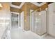 Bathroom featuring a glass enclosed shower, a vanity, and a connecting door to another room at 4385 Old Hamilton Mill Rd, Buford, GA 30518