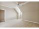 Bedroom with neutral carpet, sloped ceilings, ceiling fan and entry doorway at 4385 Old Hamilton Mill Rd, Buford, GA 30518