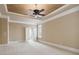 Bright bedroom with tray ceiling, neutral walls and views of the bathroom and natural light at 4385 Old Hamilton Mill Rd, Buford, GA 30518