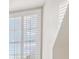 Bright bedroom with sloped ceilings and a shuttered window at 4385 Old Hamilton Mill Rd, Buford, GA 30518