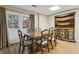 Dining area with hardwood floors, wooden furniture, and double doors at 4385 Old Hamilton Mill Rd, Buford, GA 30518