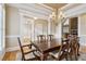 Dining room featuring wood table with seating and open access to an adjacent room, with natural light at 4385 Old Hamilton Mill Rd, Buford, GA 30518