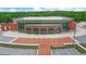 Aerial view of modern brick building with large windows, parking, and lawn at 4385 Old Hamilton Mill Rd, Buford, GA 30518