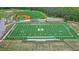 Aerial shot of a high school football field with green turf, baseball field, and sports complex at 4385 Old Hamilton Mill Rd, Buford, GA 30518