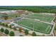 Aerial view of a high school football stadium and multiple football fields with green turf and clear markings at 4385 Old Hamilton Mill Rd, Buford, GA 30518