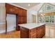Spacious kitchen features a large island, bright windows, hardwood floors and lots of cabinet space at 4385 Old Hamilton Mill Rd, Buford, GA 30518