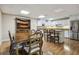 Open kitchen and dining area with stainless steel appliances and hardwood flooring at 4385 Old Hamilton Mill Rd, Buford, GA 30518